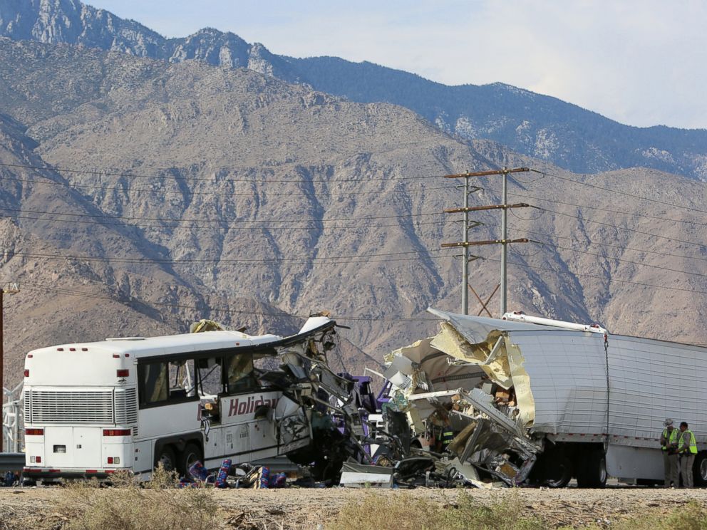PHOTO: Investigators confer at the scene of a mass casualty bus crash on the westbound Interstate 10 freeway near Palm Springs, California, Oct. 23, 2016.