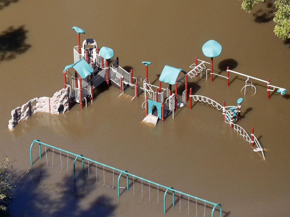 PHOTO: Flooding waters of the Tar River cover a playground due to rainfall from Hurricane Matthew in Greenville, North Carolina, Oct. 11, 2016. 