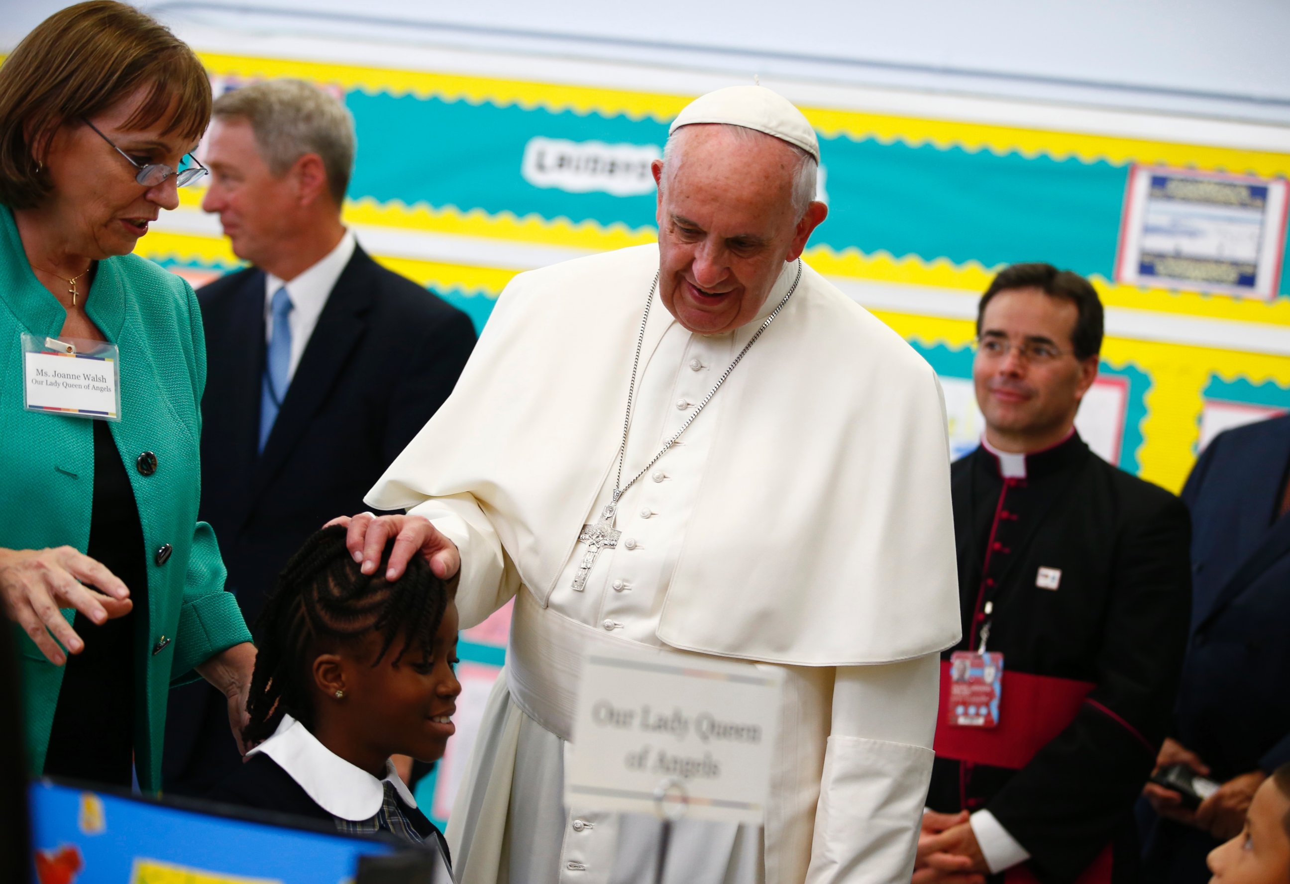 PHOTO: Pope Francis touches a student's head as he visits Our Lady Queen of Angels School in East Harlem in New York, Sept. 25, 2015. 