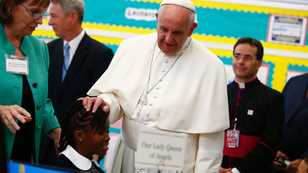 PHOTO: Pope Francis touches a student's head as he visits Our Lady Queen of Angels School in East Harlem in New York, Sept. 25, 2015. 