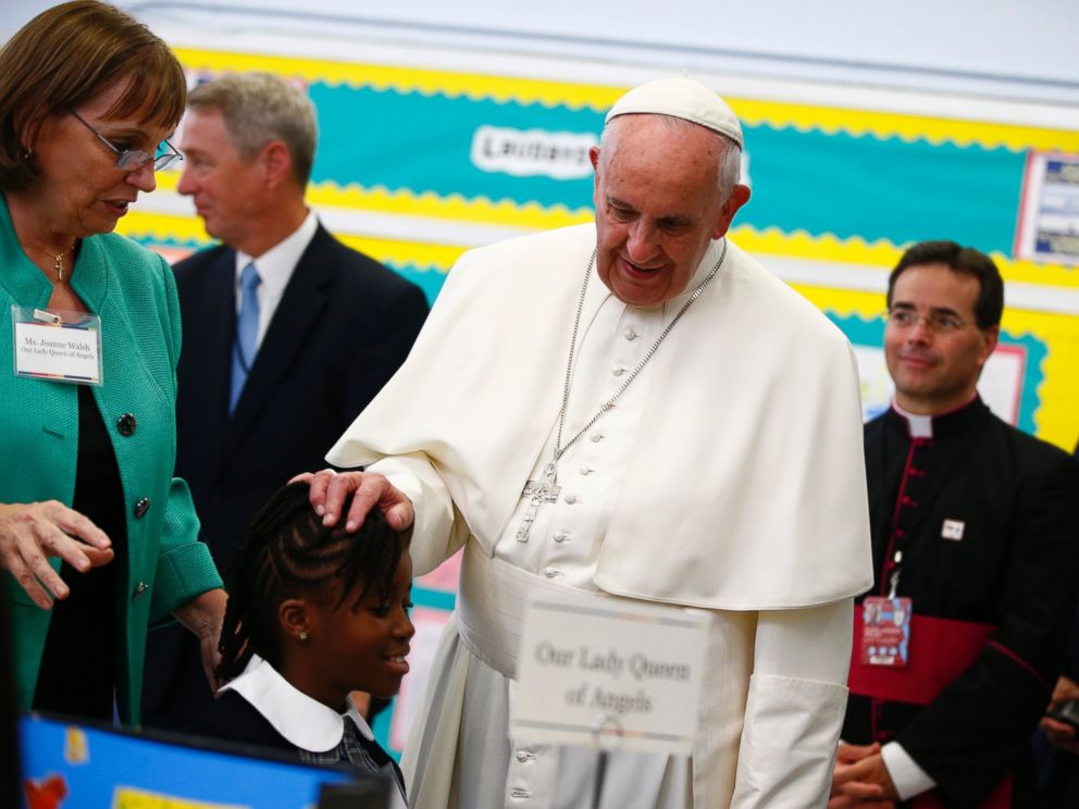 PHOTO: Pope Francis touches a students head as he visits Our Lady Queen of Angels School in East Harlem in New York, Sept. 25, 2015.
