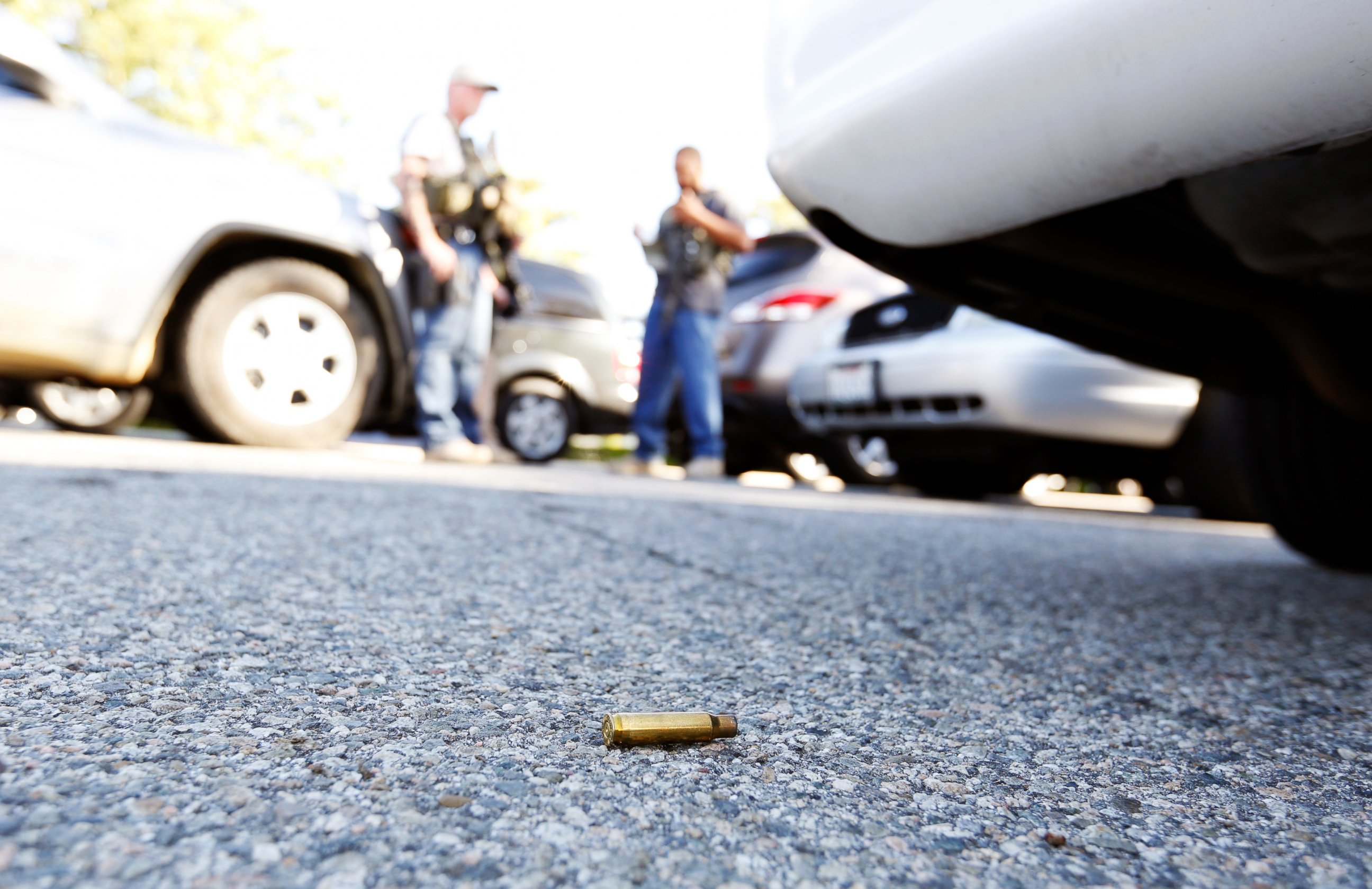 PHOTO: A spent cartridge lies on the ground as police officers secure the area after at least one person opened fire at a social services agency in San Bernardino, Calif., Dec. 2, 2015. 