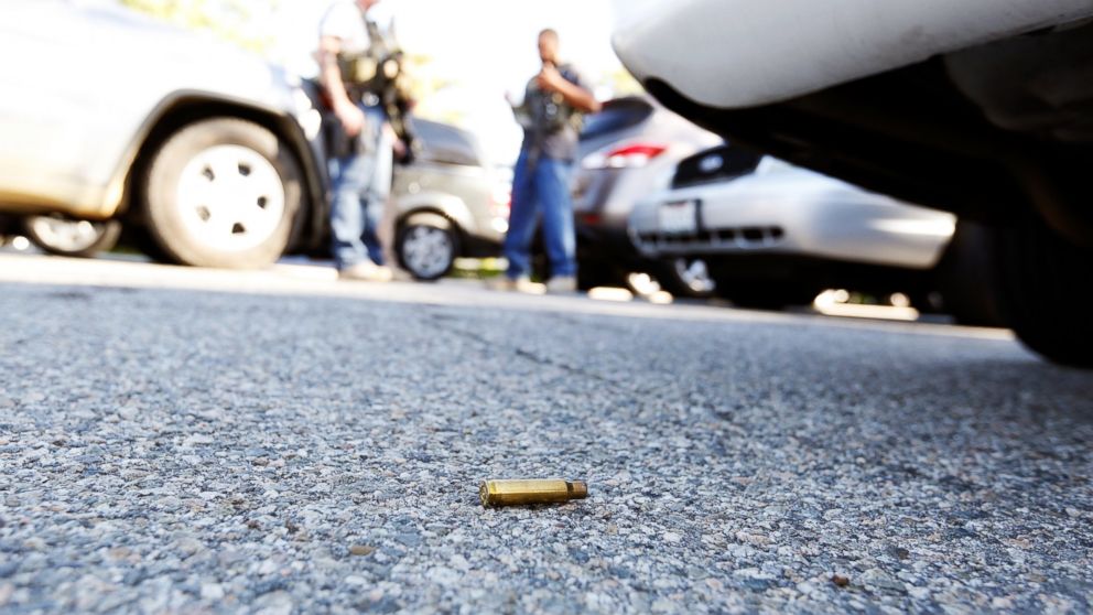 PHOTO: A spent cartridge lies on the ground as police officers secure the area after at least one person opened fire at a social services agency in San Bernardino, Calif., Dec. 2, 2015. 