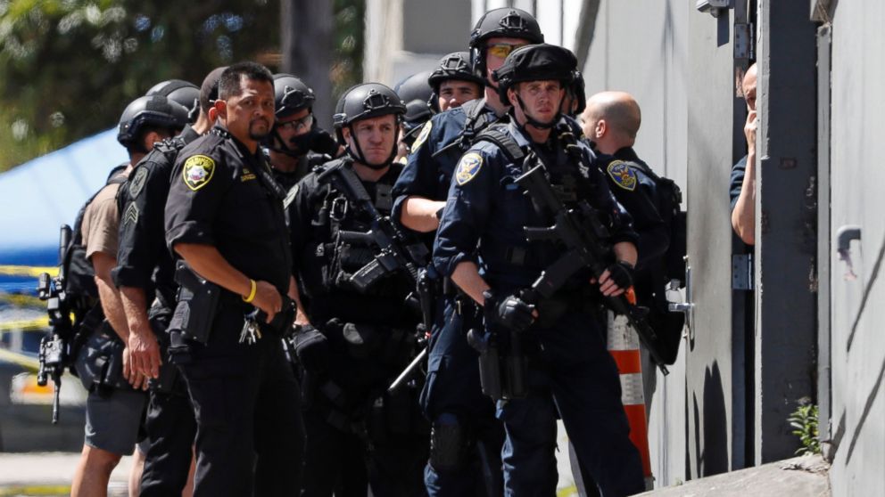 PHOTO: Police officers gather outside a UPS facility after a shooting incident was reported in San Francisco, June 14, 2017.