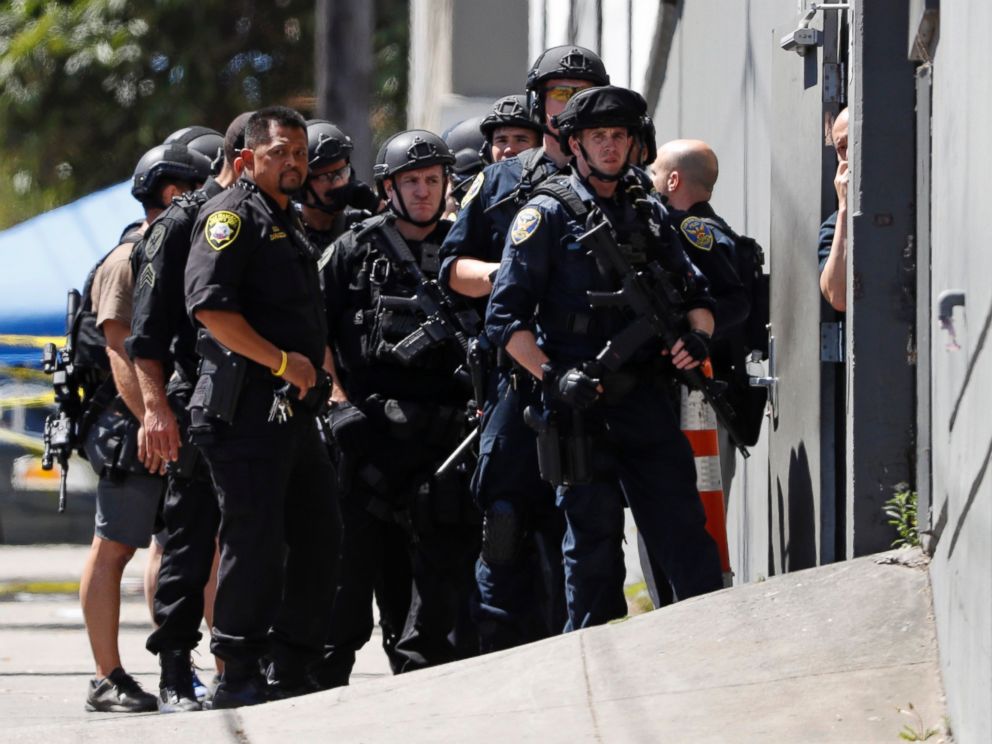 PHOTO: Police officers gather outside a UPS facility after a shooting incident was reported in San Francisco, June 14, 2017.