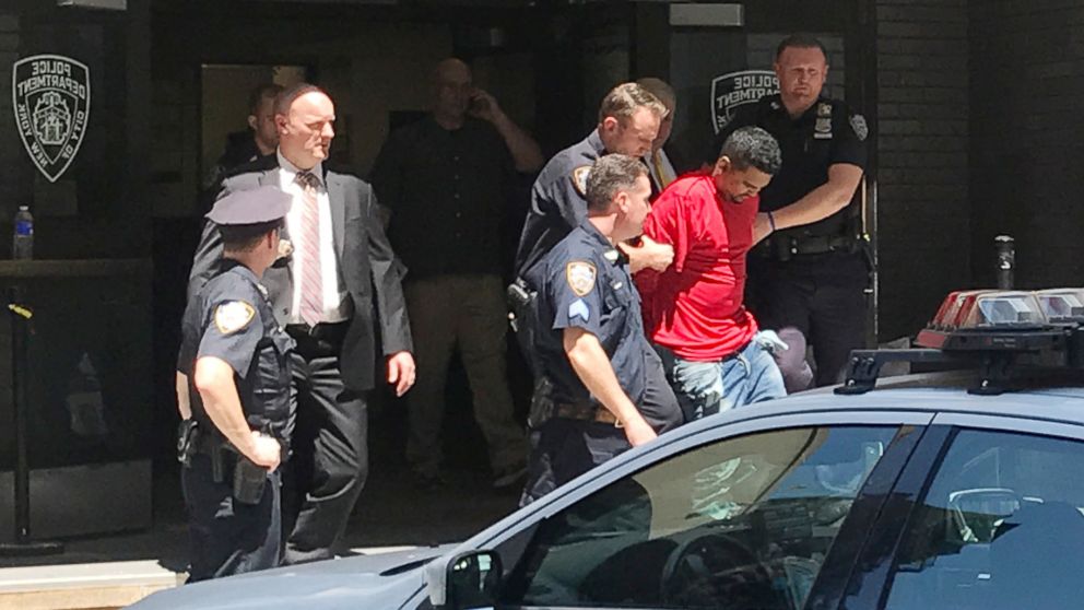 PHOTO: A man, who police said was the suspected driver of a car which crashed into a crowd on Times Square, is led out of the NYPD Midtown South precinct in New York, May 18, 2017.