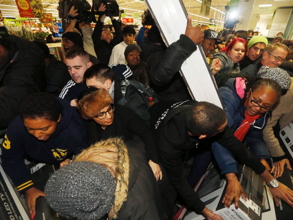 PHOTO: Shoppers compete to purchase retail items on Black Friday at an Asda superstore in Wembley, north London November 28, 2014.