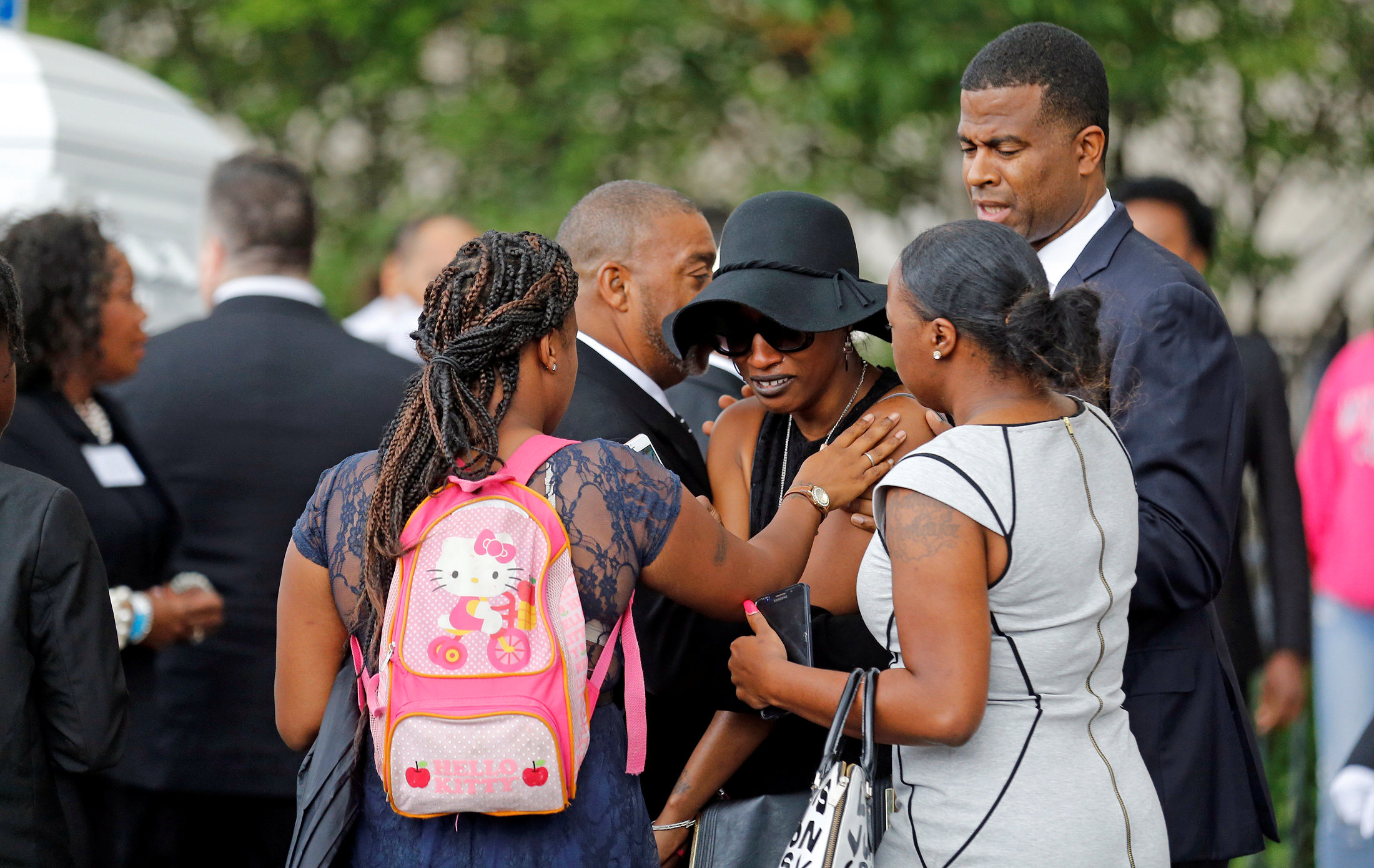 PHOTO: Family members comfort Diamond Reynolds as the casket of Philando Castile is taken into the Cathedral of St. Paul in St. Paul, Minnesota, July 14, 2016. 