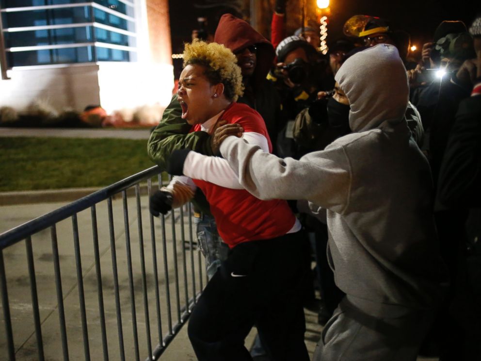 PHOTO: A woman approaches the barricade to confront the police outside the Ferguson Police Department in Ferguson, Mo. on Nov. 24, 2014.