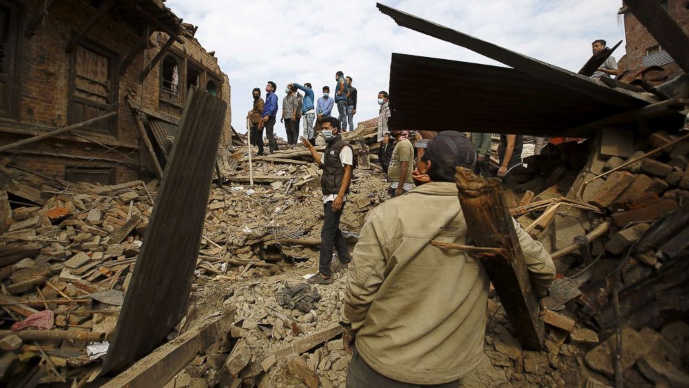 PHOTO: People search for their belongings amidst the rubble of houses collapsed by an earthquake at Bhaktapur, Nepal, April 30, 2015.