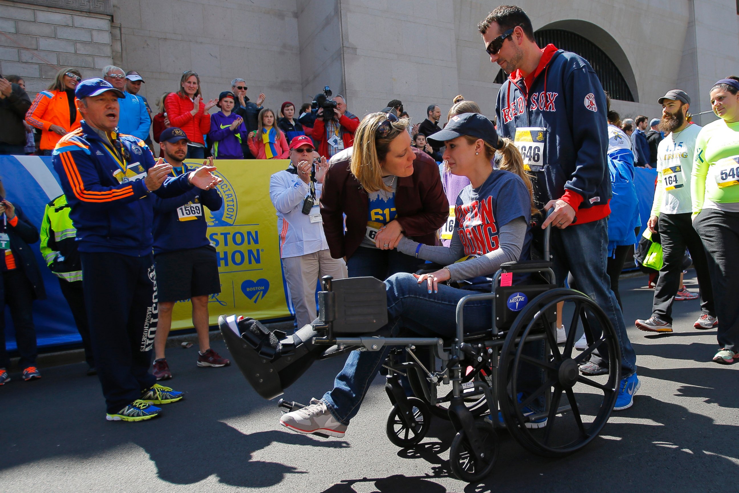 PHOTO: 2013 Boston Marathon bombing survivor Rebekah Gregory DiMartino crosses the marathon finish line during a Tribute Run for survivors and first responders in Boston on April 19, 2014.