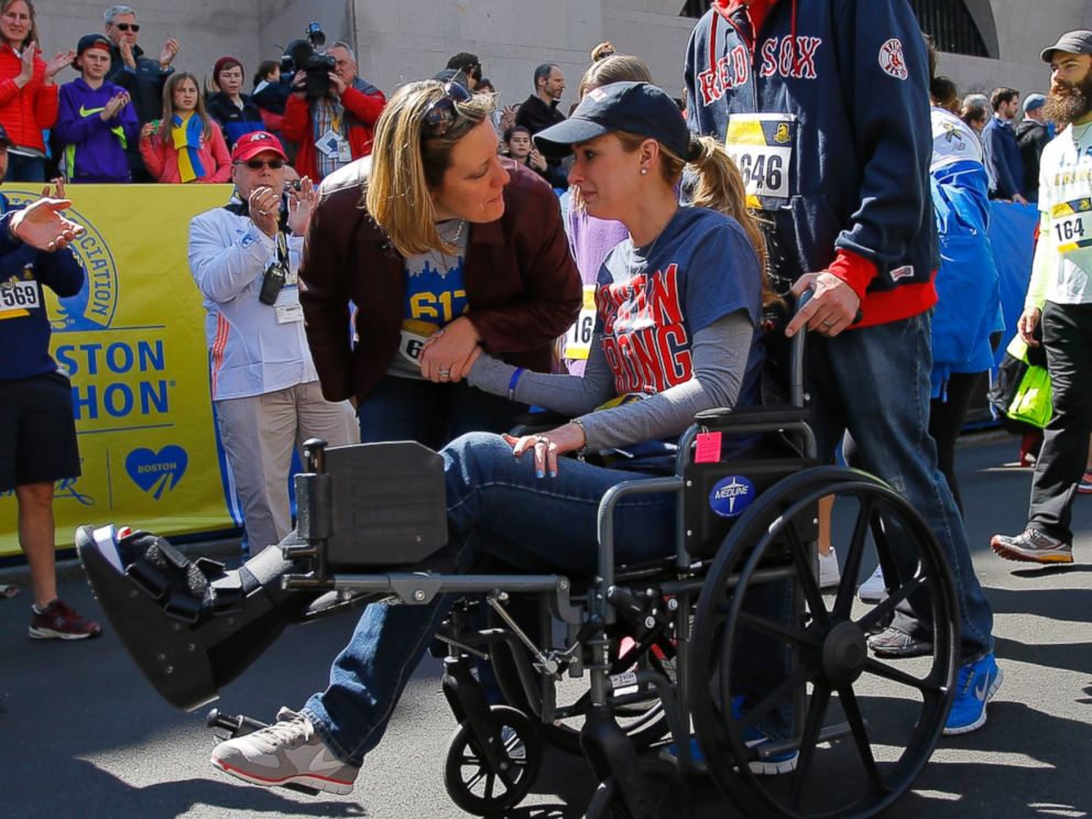 PHOTO: 2013 Boston Marathon bombing survivor Rebekah Gregory DiMartino crosses the marathon finish line during a Tribute Run for survivors and first responders in Boston on April 19, 2014.