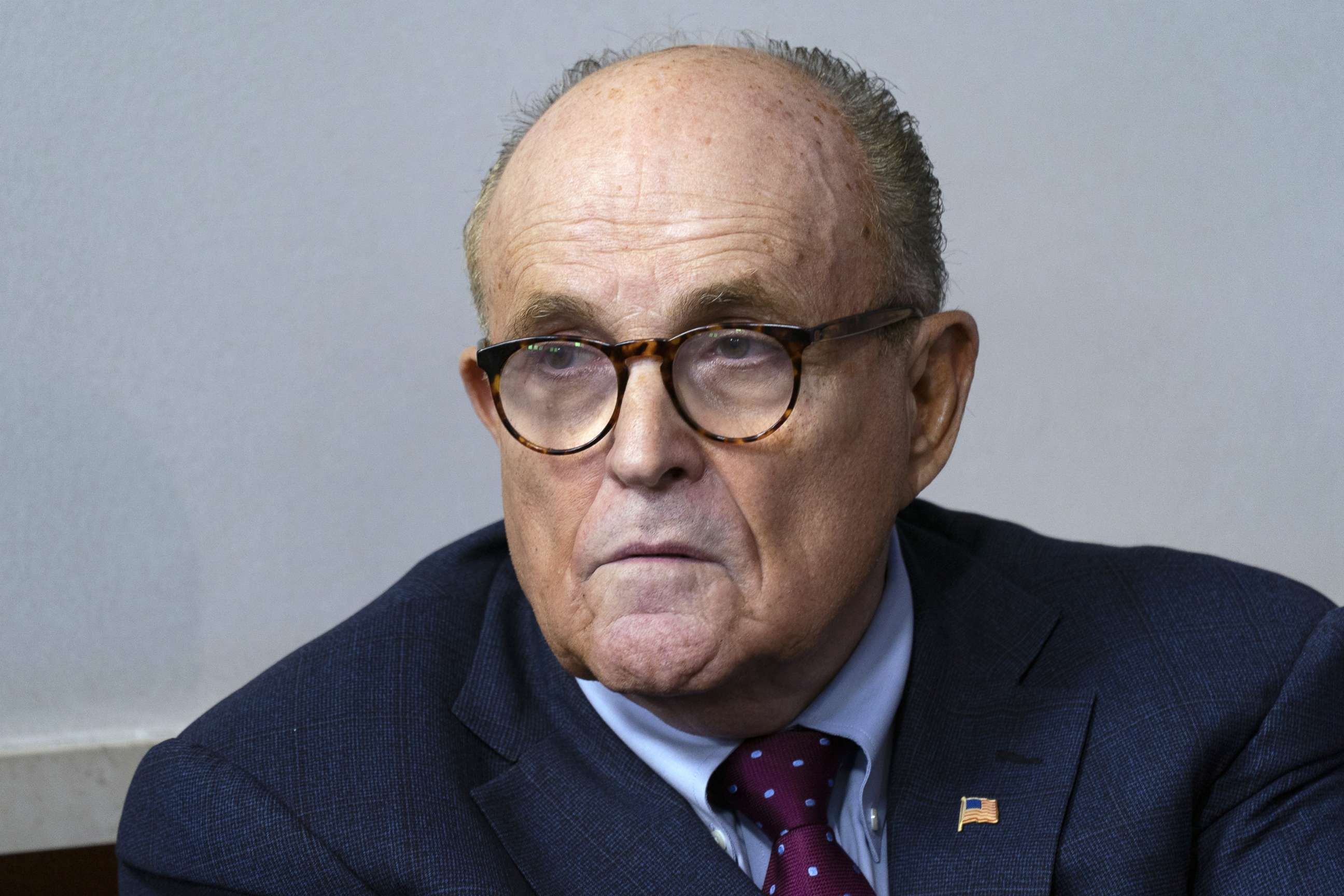 PHOTO: Rudy Giuliani listens as President Donald Trump speaks during a news conference at the White House in Washington, D.C., Sept. 27, 2020.