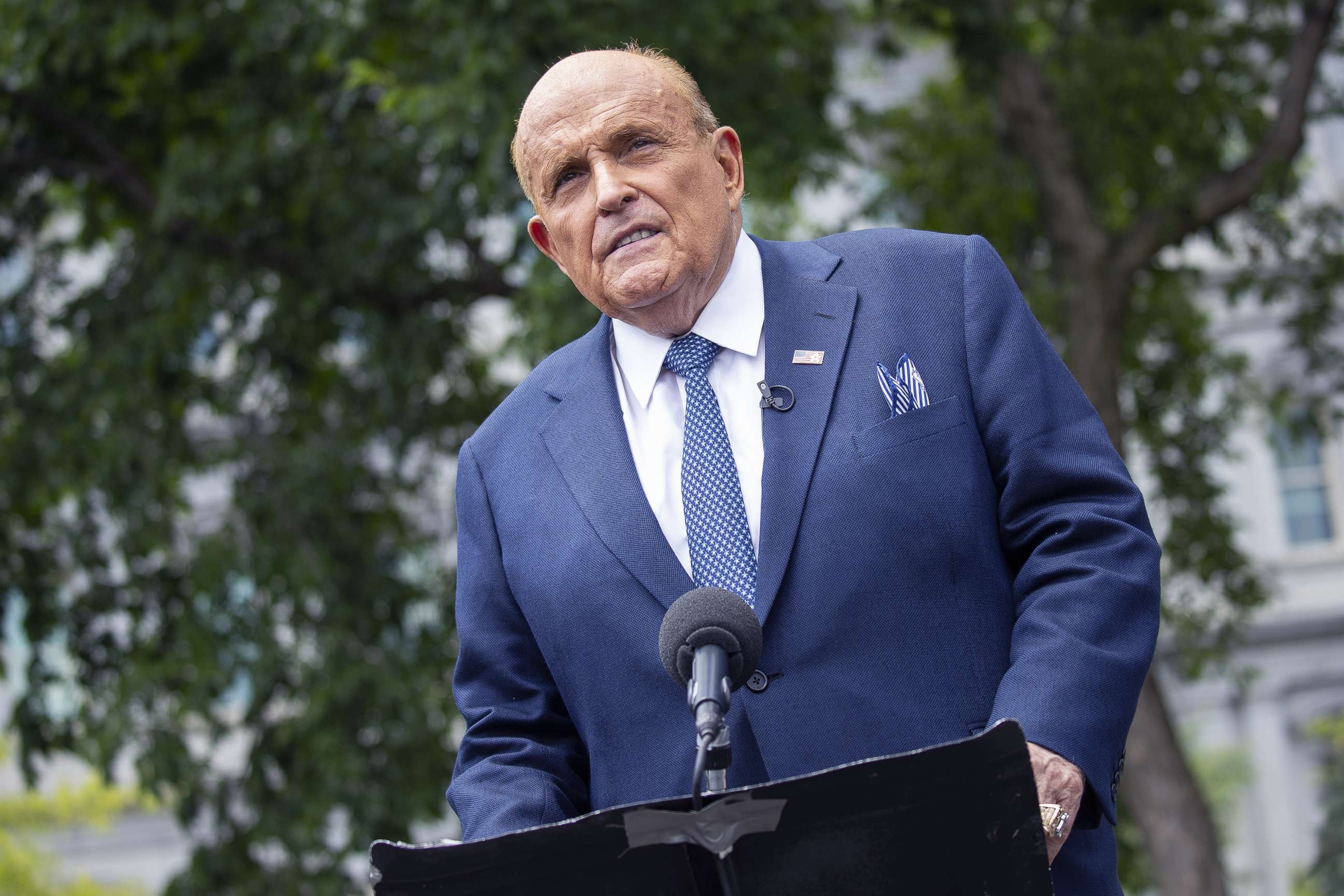PHOTO: Rudy Giuliani, personal lawyer to President Donald Trump, speaks to members of the media following a television interview outside the White House, July 1, 2020.