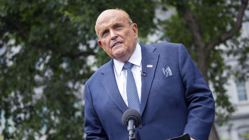 PHOTO: Rudy Giuliani, personal lawyer to President Donald Trump, speaks to members of the media following a television interview outside the White House, July 1, 2020.