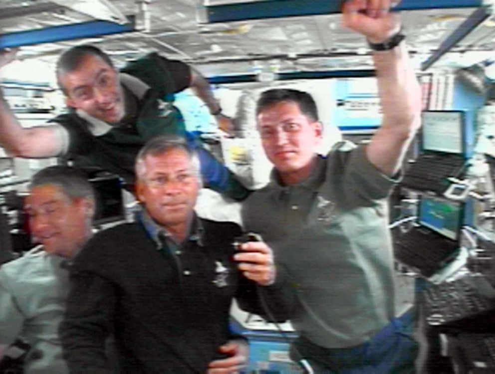 PHOTO: Philippe Perrin, Valeri Korzun, Ken Cockrell and Sergei Trechev talk with Mission Control Moscow on June 2, 2002. 