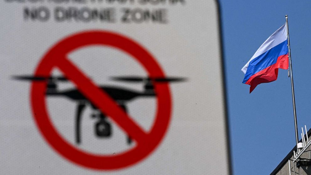 PHOTO: FILE - In this file photo taken on April 12, 2023 A "No Drone Zone" sign is pictured in front of the Russian national flag atop the Federation Council building, the upper chamber of Russia's parliament, in central Moscow.