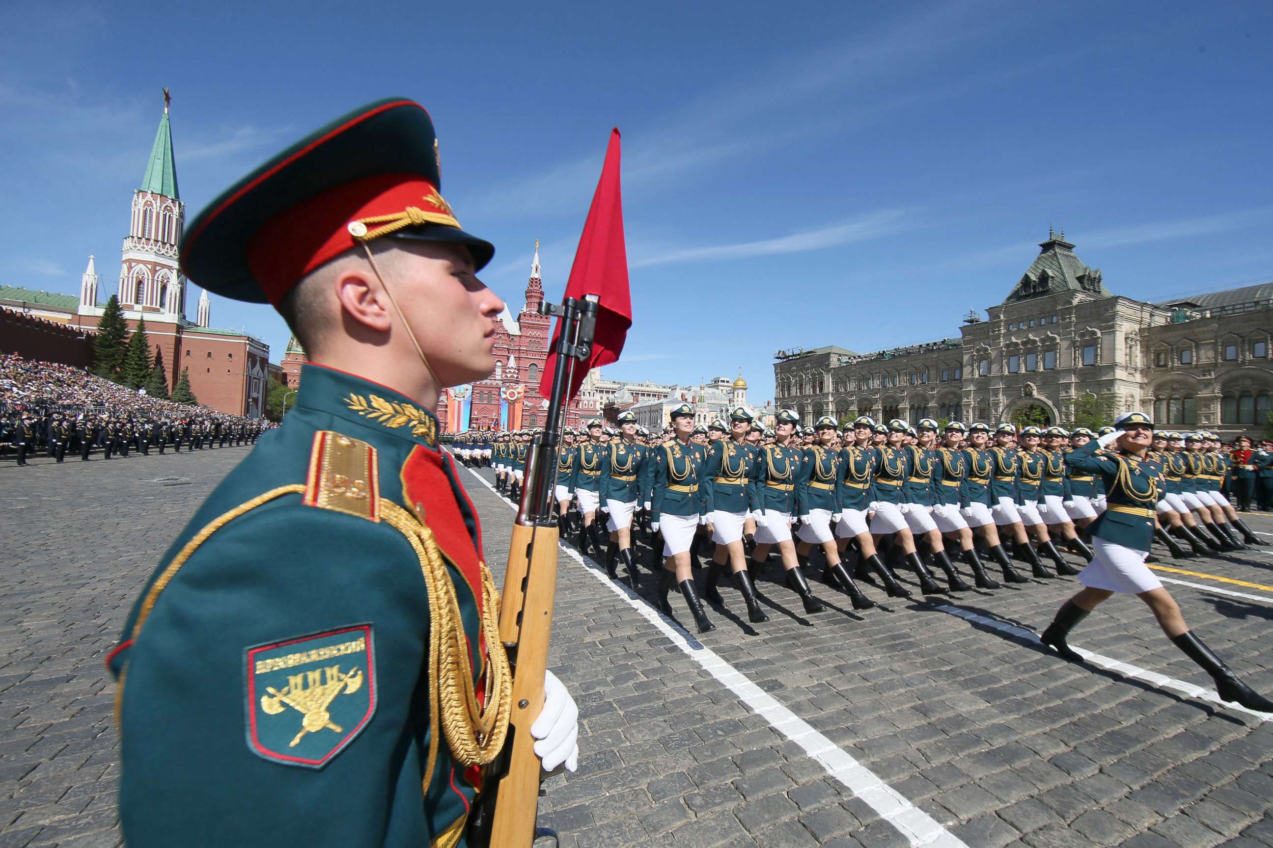 PHOTO: Russian female soldiers (back) march during the Victory Day military parade in the Red Square in Moscow, May 9, 2018.