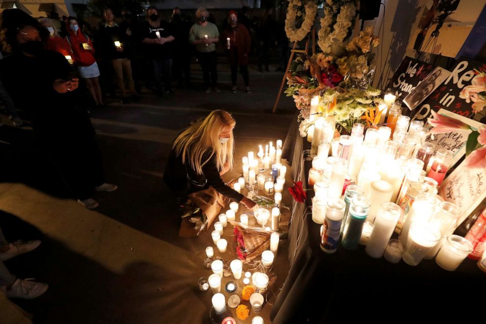 PHOTO: People attend a vigil for late cinematographer Halyna Hutchins, who was fatally shot on the film set of "Rust", in Burbank, Calif., Oct. 24, 2021.