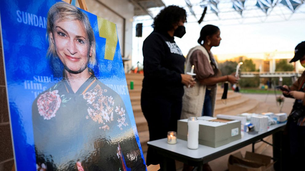 PHOTO: An image of cinematographer Halyna Hutchins, who died after being shot by Alec Baldwin on the set of her film "Rust"is displayed at a vigil in his honor in Albuquerque, NM, October 23, 2021.