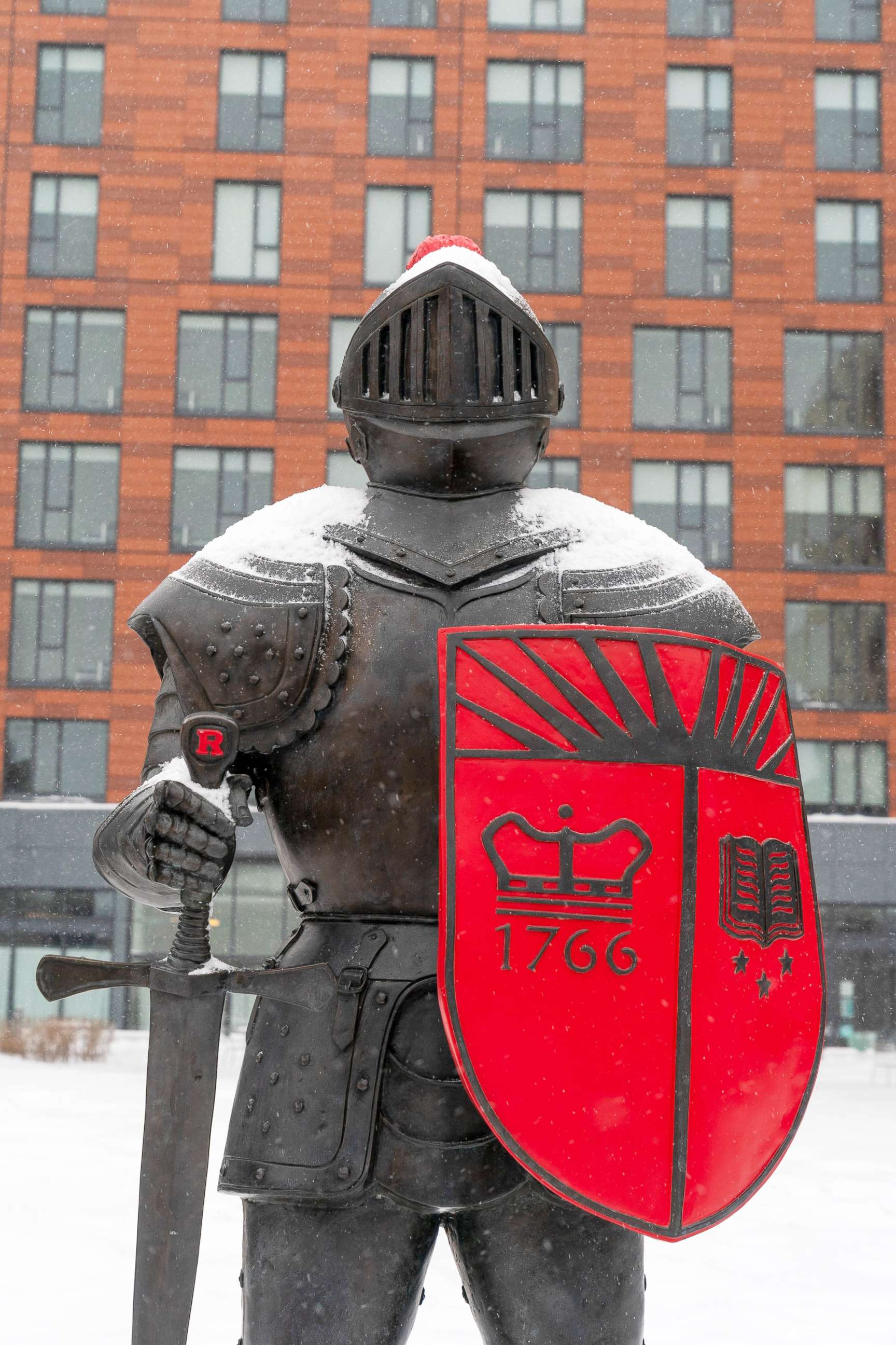 PHOTO: The Rutgers Scarlet Knight stands at the College Avenue bus stop on the corner of College Avenue and Hamilton Street on the Rutgers campus in New Brunswick, N.J., Feb. 18, 2021.