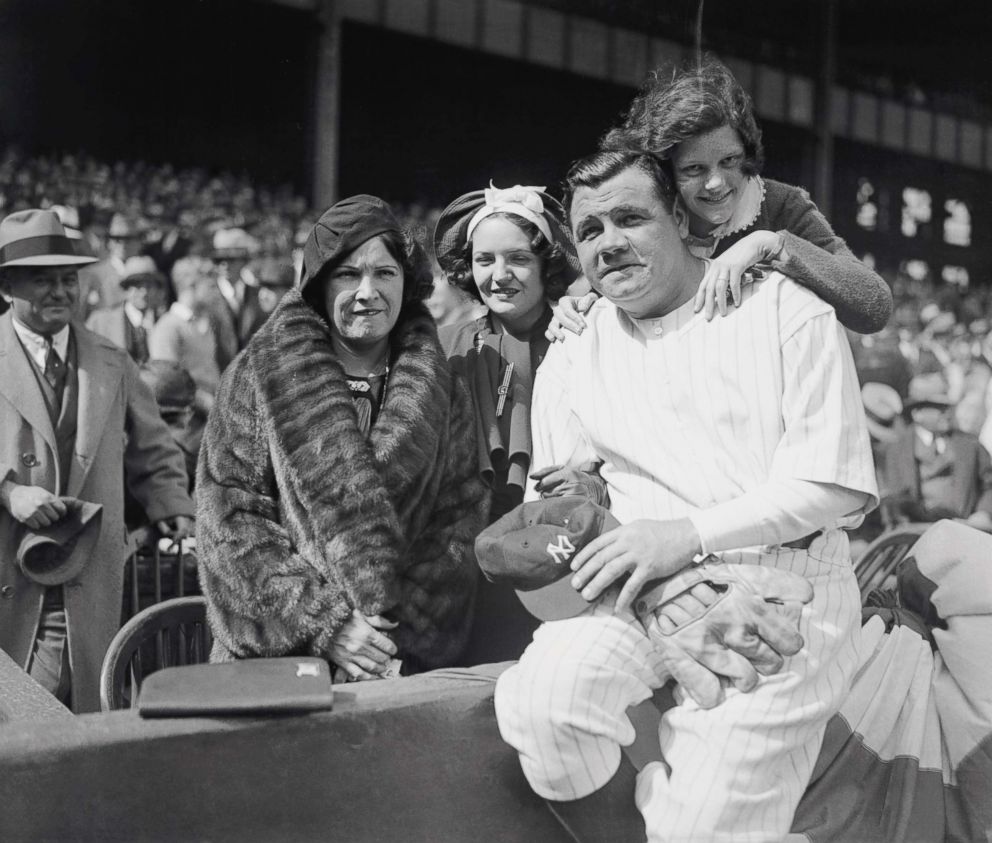 PHOTO: Babe Ruth and his family, Mrs. Ruth and his daughters Julia,center, and Dorothy is behind him, at Yankee Stadium, April 24, 1934.