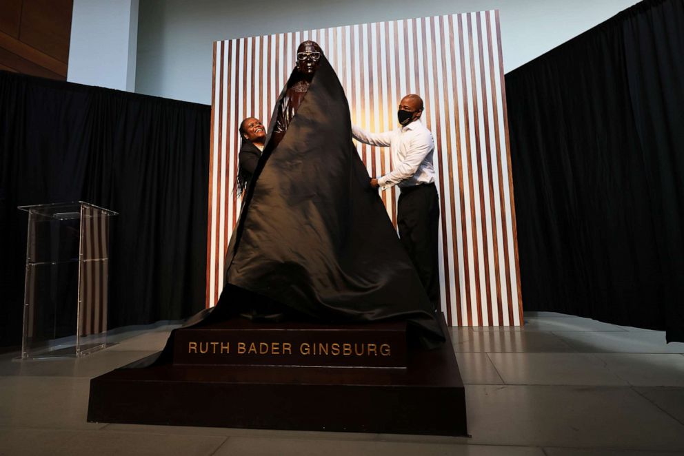 PHOTO: Rodneyse Bichotte Hermelyn, NYS 42nd District leader, and Eric Adams, Brooklyn Borough president NYC mayoral candidate, unveil the statue of the late US Supreme Court Justice Ruth Bader Ginsburg on March 12, 2021, in New York.