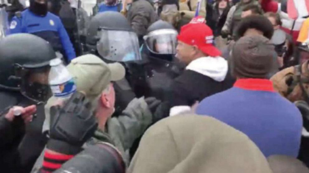 PHOTO: In this photo that was part of the Department of Justice criminal complaint, Ryan Samsel is shown in a red baseball cap confronting police officers at the Capitol on Jan. 6, 2021.