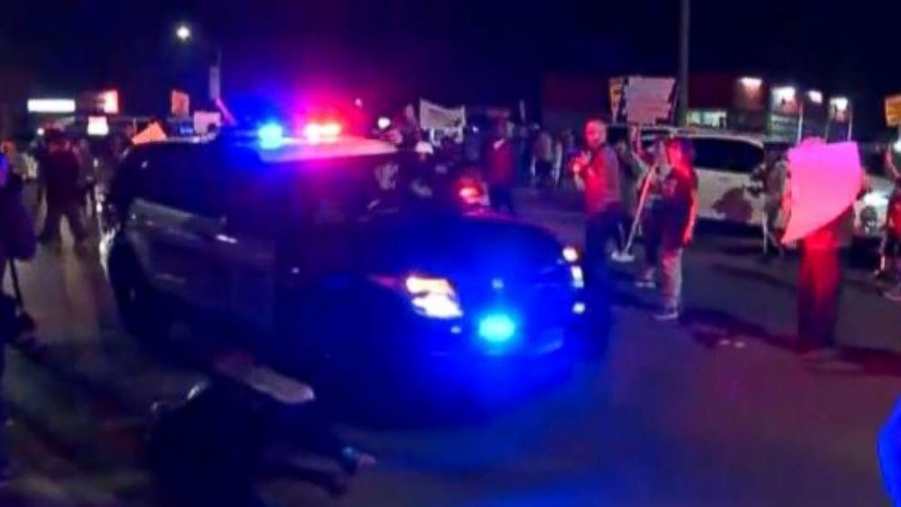 A protester, bottom left, was struck by a Sacramento County Sheriff’s Department vehicle during a march against the shooting of Stephon Clark on Saturday, March 31, 2018.