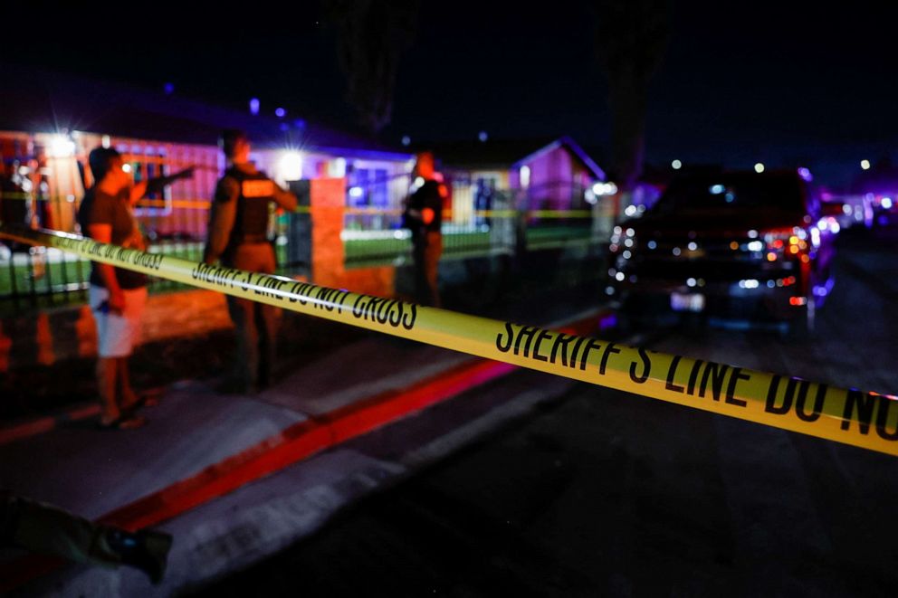 PHOTO: A sheriff's deputy talks with a resident following a shooting at a church in Sacramento, California, on Feb. 28, 2022. 