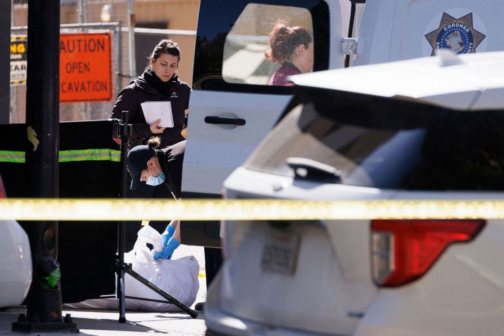 PHOTO: Members of the Coroners Office prepares to move one of the victims from the scene after a mass shooting in downtown Sacramento, Calif., April 3, 2022.