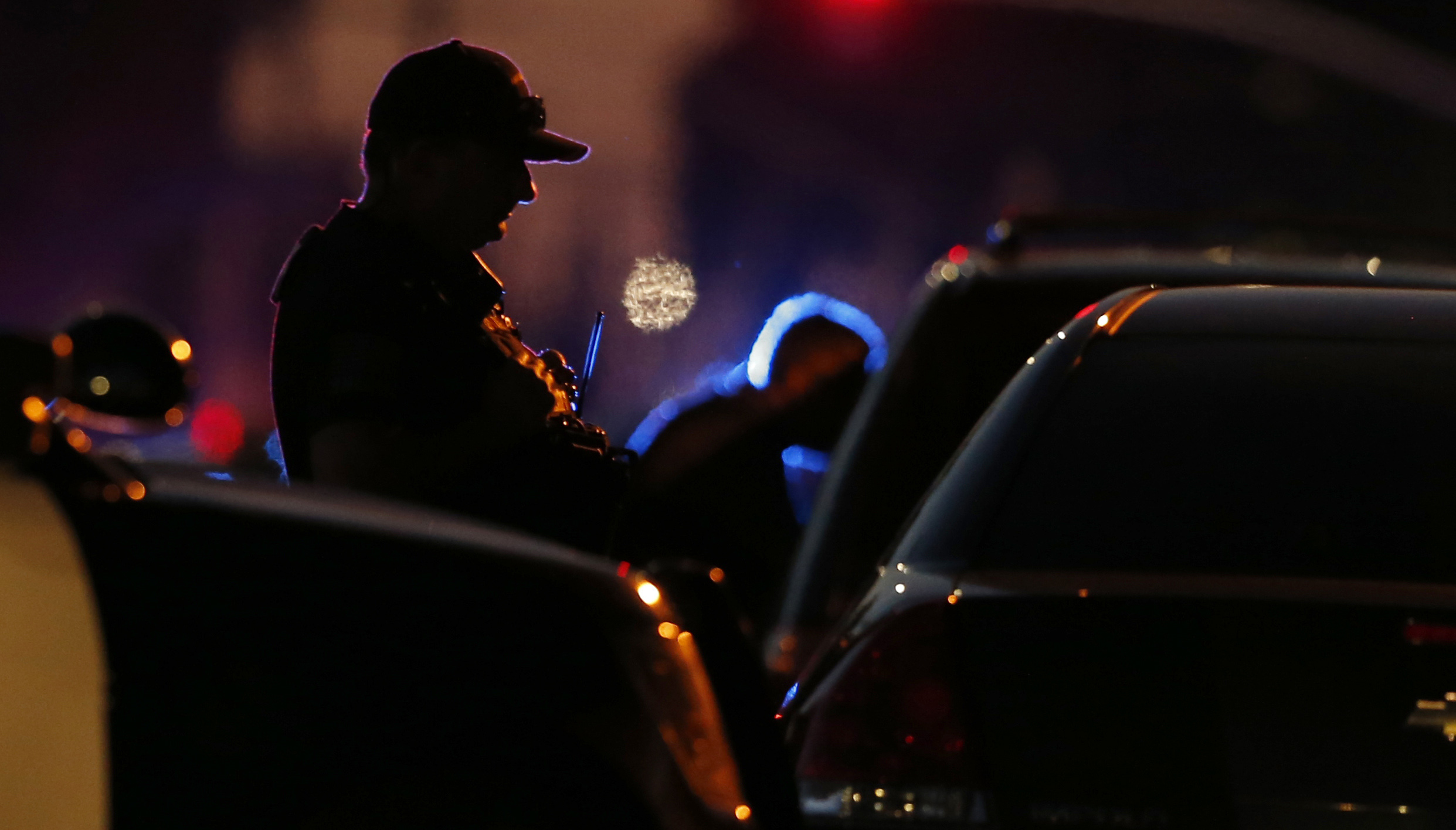 PHOTO: A law enforcement officer mans a barricade near a home after shooting of a  Sacramento police officer, June 19, 2019, in Sacramento, Calif.