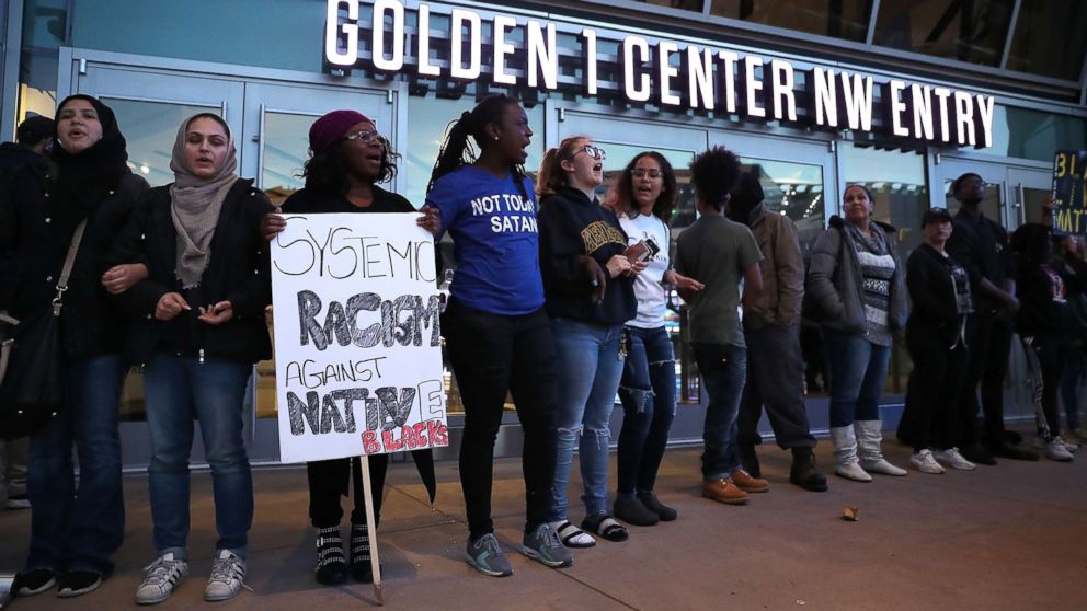 PHOTO: Black Live Matter protesters chant as they block the entrance to the Golden 1 Center during a demonstration on March 22, 2018 in Sacramento, Calif. 