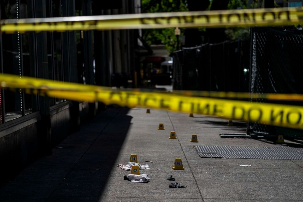 PHOTO: Poloce tape isolates a crime scene in downtown Sacramento on Sunday April 3, 2022, where six people were shot and killed, and 10 injured the previous day.