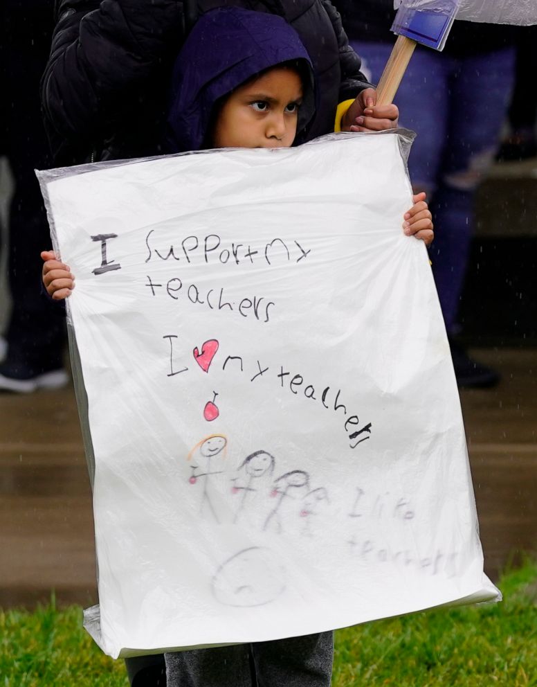 PHOTO: First grader Yara Torres Hernandez, 7, attends a rally held by teachers, parents, and students supporting a strike against the Sacramento Unified School District at Rosemont High School in Sacramento, Calif., March 28, 2022.