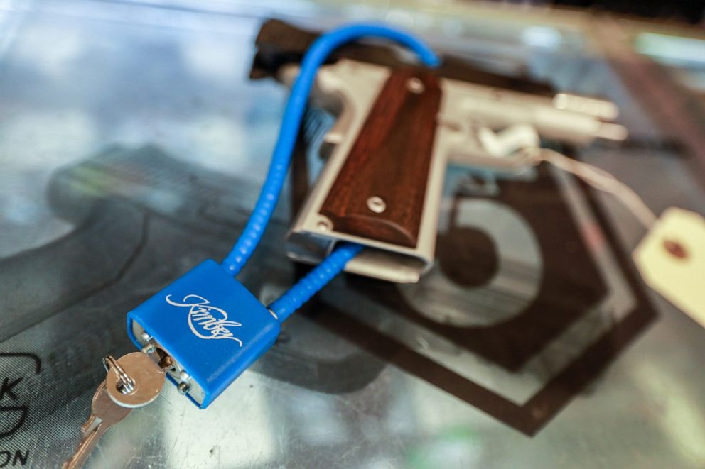 PHOTO: A cable lock secures a pistol at Brown Bear Sporting Goods store in Chesterfield Twp., Mich. on  Jan. 23, 2021.