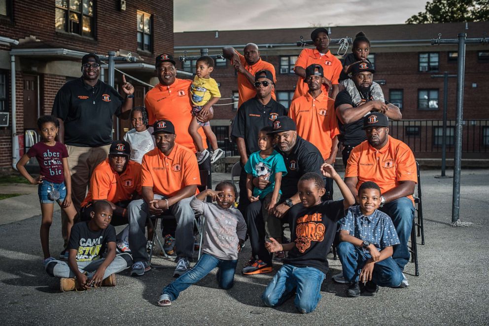 PHOTO: Neighborhood children join Safe Streets staff and violence interruptors for a group photo in Baltimore, June 9, 2016.