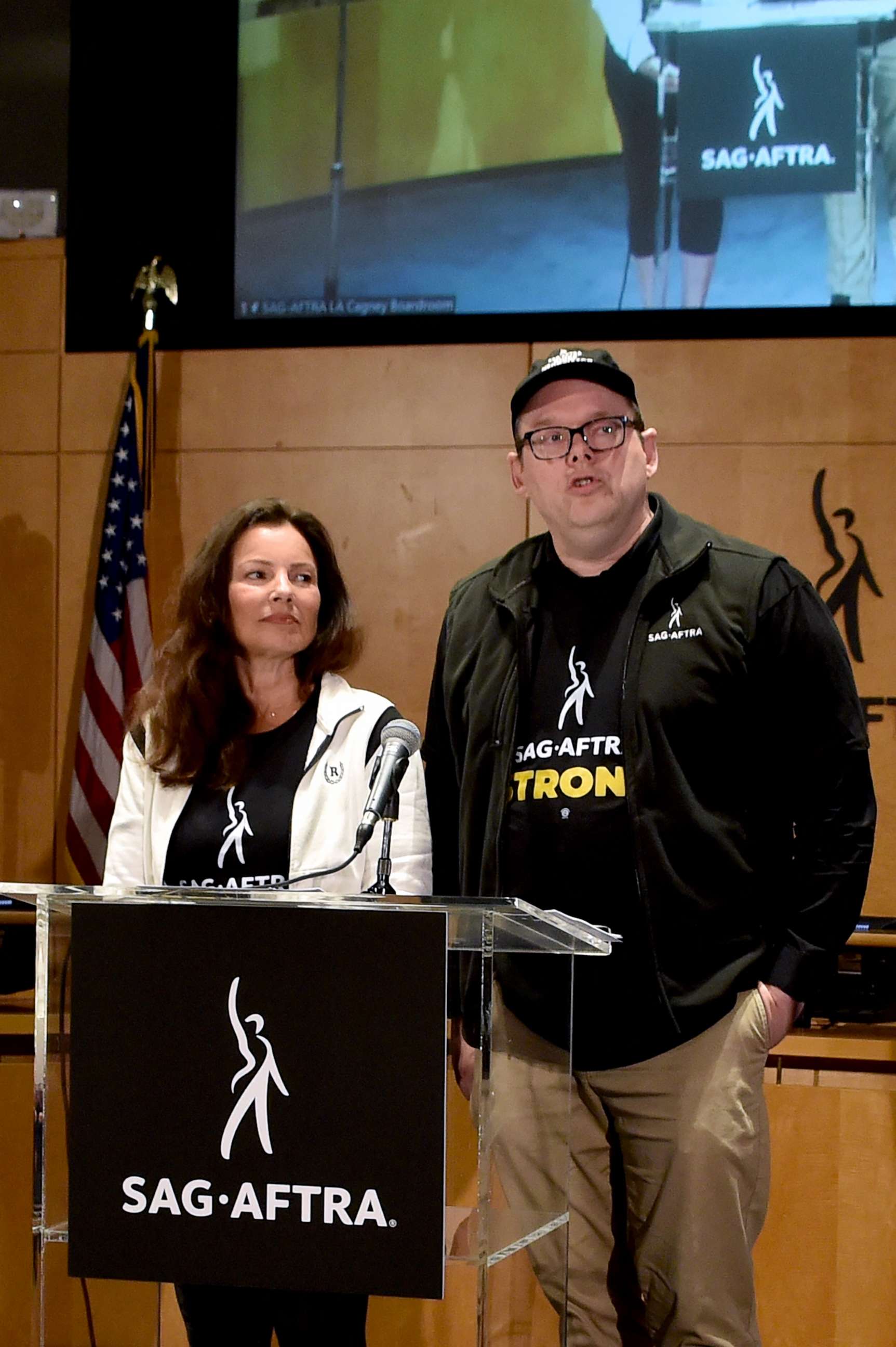 PHOTO: SAG-AFTRA President and actress Fran Drescher listens as National Executive Director and Chief Negotiator Duncan Crabtree-Ireland speaks during a press conference at the labor union's headquarters in Los Angeles, July 13, 2023.