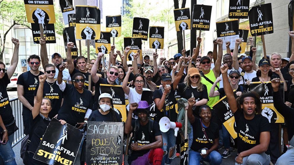 PHOTO: SAG-AFTRA members walk a picket line in support of the SAG-AFTRA and WGA strike outside Warner Bros. Discovery Headquarters on Aug. 31, 2023 in New York City.