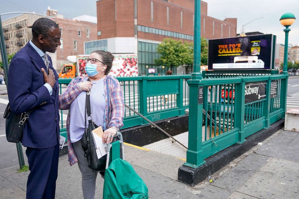 PHOTO: New York City Council candidate Yusef Salaam, left, talks to a Harlem resident while canvasing in the neighborhood, May 24, 2023, in New York.