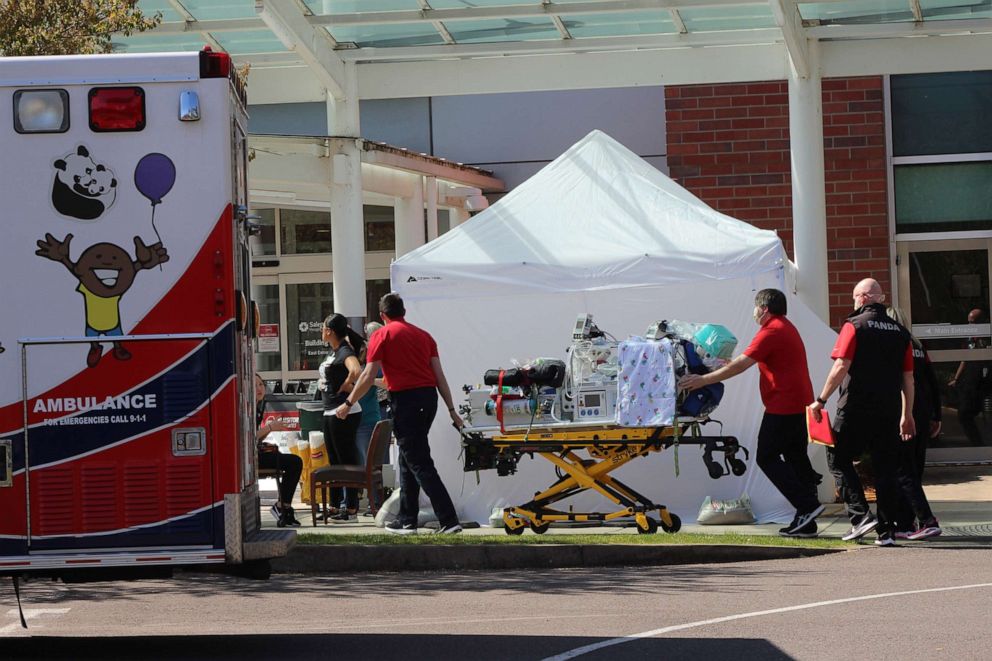 PHOTO: Healthcare workers wheel a gurney into Salem Hospital's emergency room in Salem, Oregon, on April 9, 2020, amid the coronavirus pandemic.
