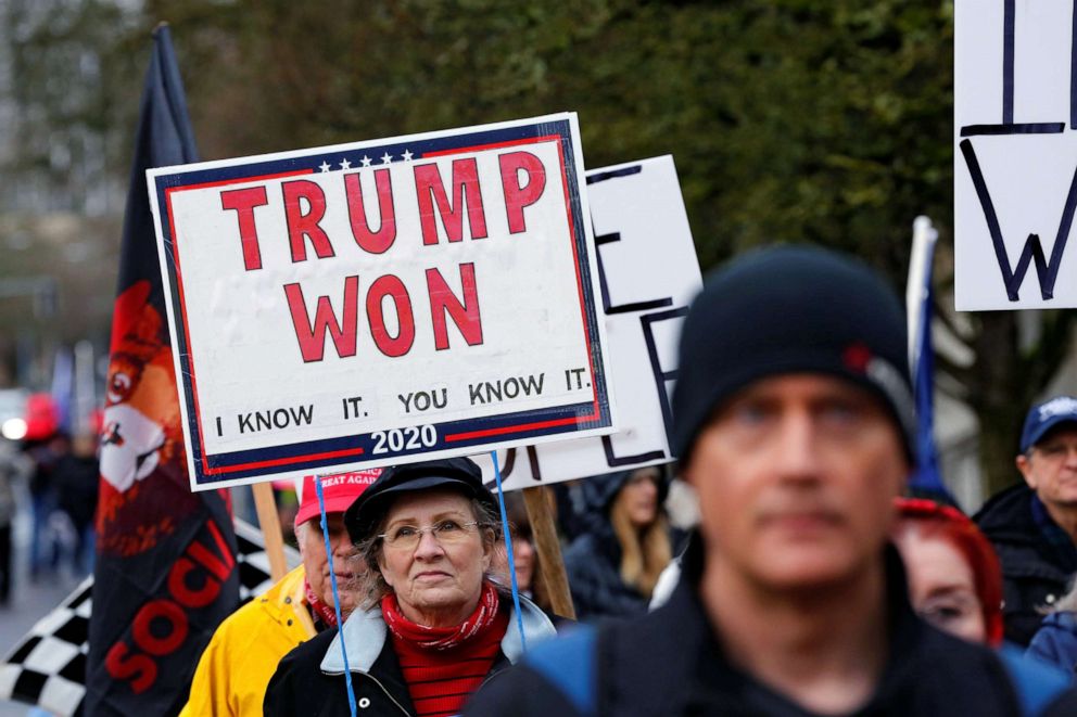 PHOTO: A protester holds a sign saying "Trump Won" at a rally in support of President Donald Trump at the Oregon State Capitol in Salem, Oregon, Jan. 6, 2021.
