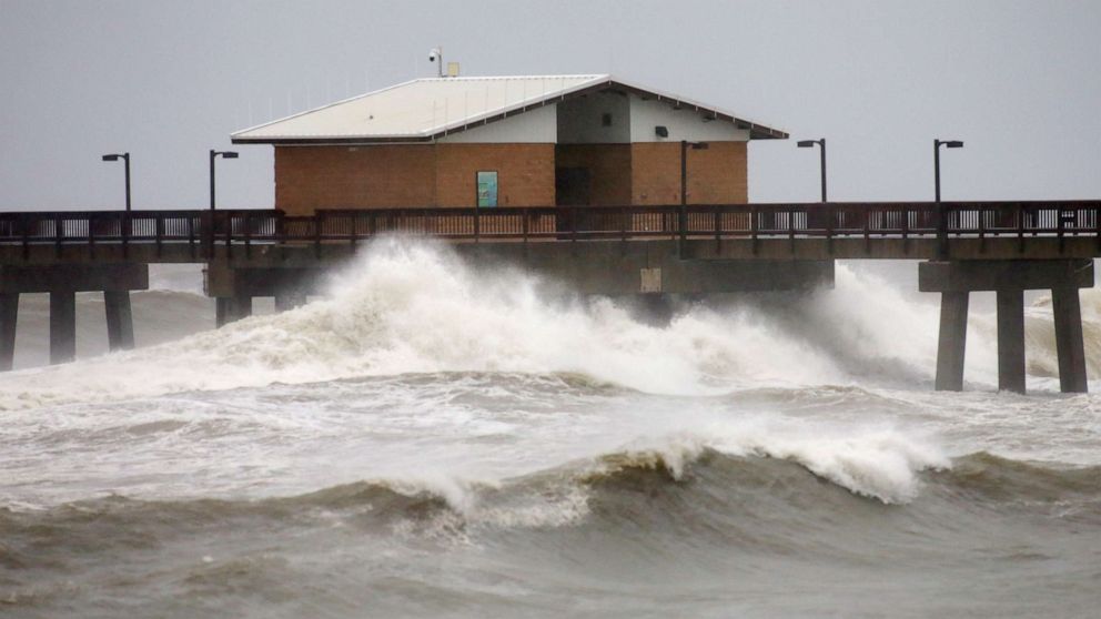 PHOTO: Waves crash along a pier as Hurricane Sally approaches in Gulf Shores, Ala., Sept. 15, 2020.