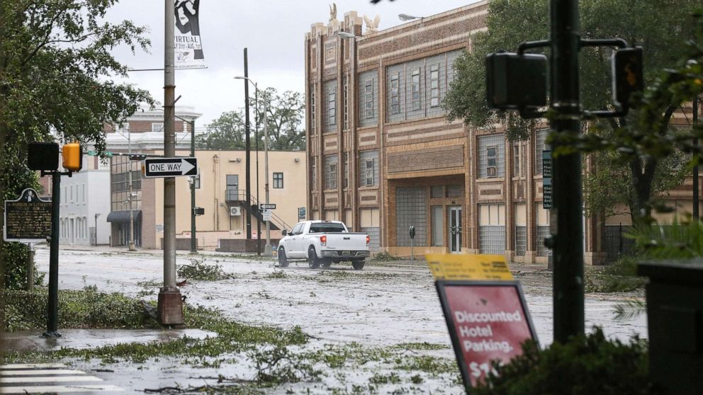 PHOTO:A car drives down Government Street during Hurricane Sally in Mobile, Ala., Sept. 16, 2020.