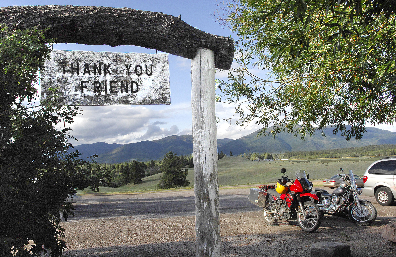 PHOTO: In this file photo taken on July 9, 2009, the Bob Marshall Wilderness cuts a jagged line across the horizon as patrons leave Trixi's Antler Saloon in Ovando, Montana.