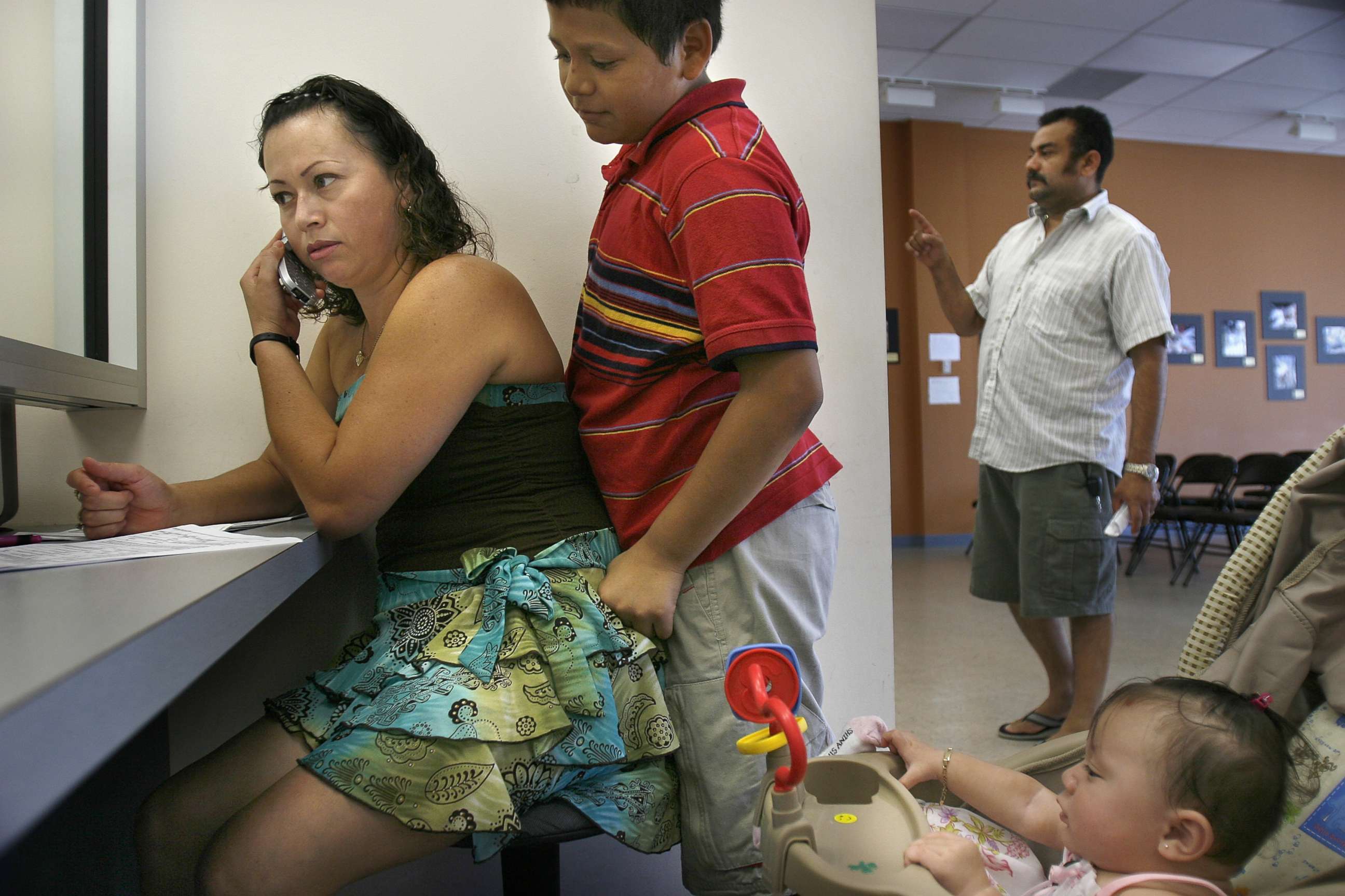 PHOTO: Selma Galindo, with her children Edgar Galindo, and daughter seven-month-old Gabriella Umanzor, apply for TPS, a permit that allows beneficiaries to work and live here legally, at the El Salvador Consulate in Woodbridge, Va., Aug. 24, 2006.