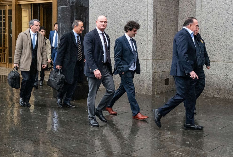 PHOTO: Cryptocurrency entrepreneur Sam Bankman-Fried, second from right, arrives for an appearance at Manhattan federal court on Jan. 3, 2023, in New York.
