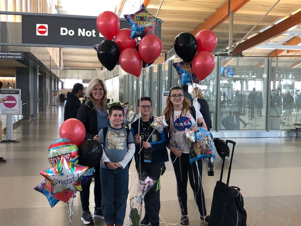 PHOTO: Debbie Schelin and Holly Grove Middle School students arriving back to North Carolina after winning top prize at Samsung Solve For Tomorrow contest.