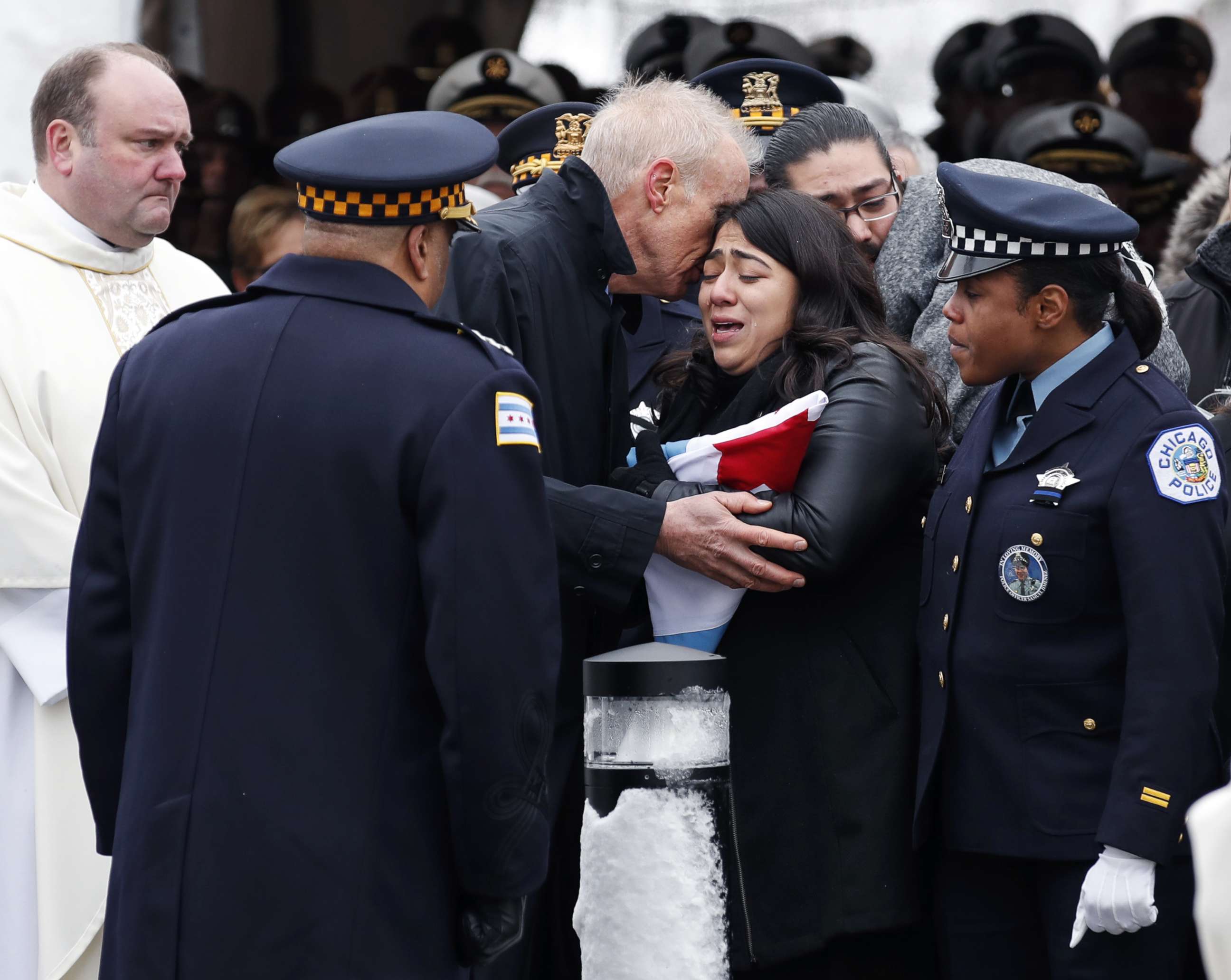 PHOTO: Illinois Governor Bruce Rauner comforts Crystal Garcia, the wife of slain Chicago Police Officer Samuel Jimenez, during funeral services at the Chapel of St Joseph at Shrine of Our Lady of Guadalupe on Nov. 26, 2018 in Des Plaines, Ill.