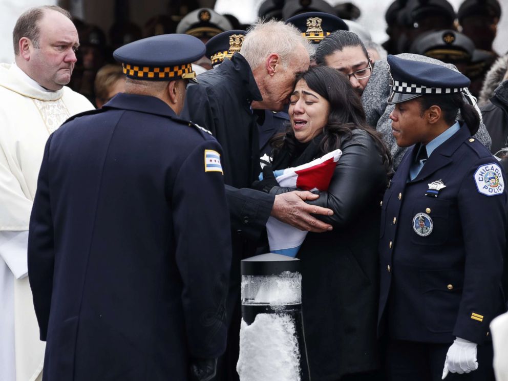 PHOTO: Illinois Governor Bruce Rauner comforts Crystal Garcia, the wife of slain Chicago Police Officer Samuel Jimenez, during funeral services at the Chapel of St Joseph at Shrine of Our Lady of Guadalupe on Nov. 26, 2018 in Des Plaines, Ill.